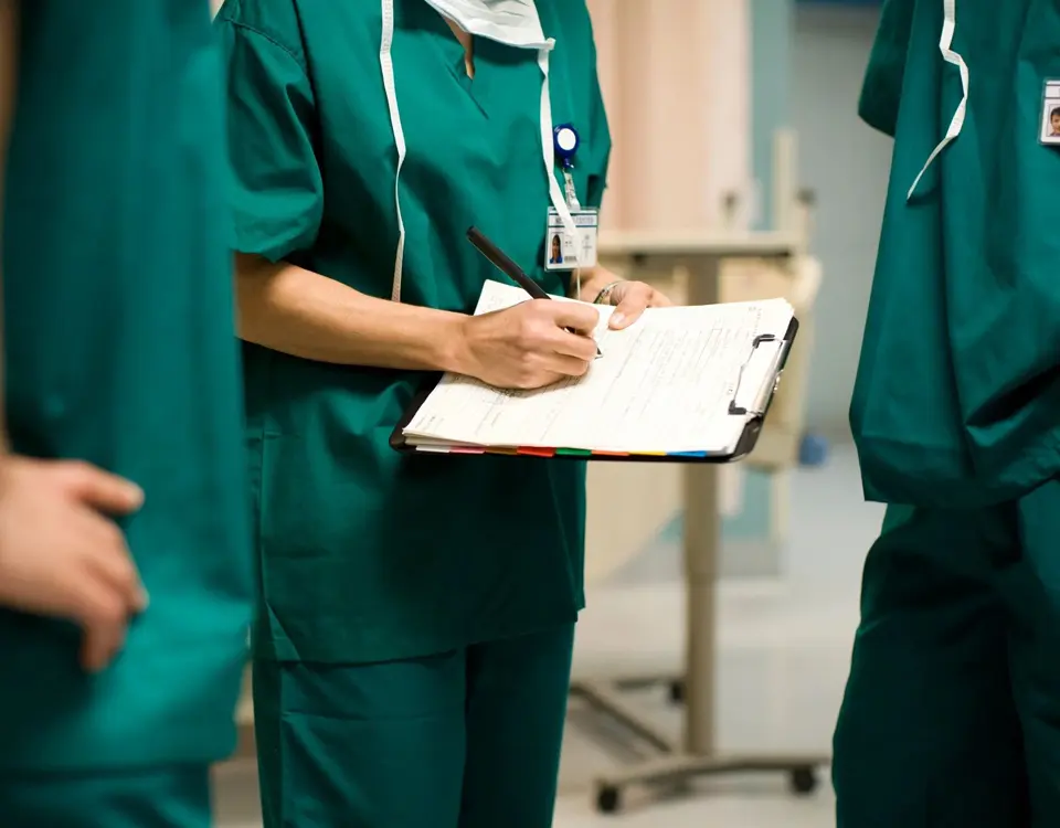 A group of doctors standing in a room.